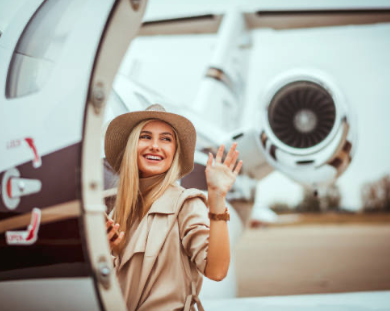 Founder smiling and waving while boarding a private aircraft